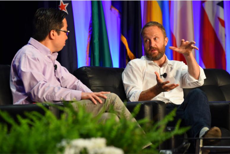 Two men mainstage speakers