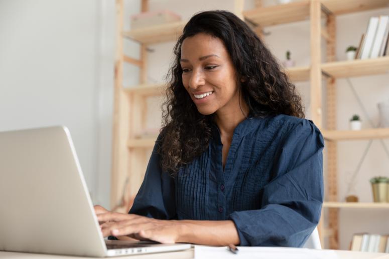 Black woman attending a virtual meeting