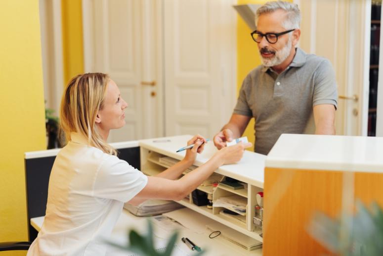 patient paying at doctor's office