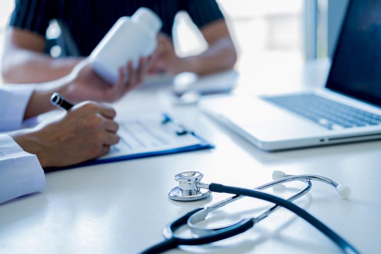 doctor and patient looking at health data