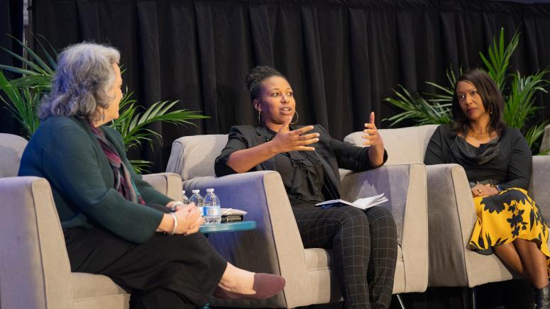 HDP presenters sitting on stage at the in-person event