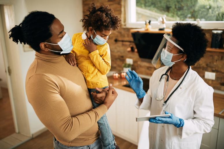 child is mask with a doctor in mask