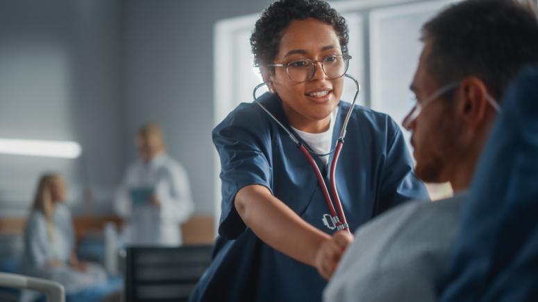 friendly nurse assisting patient