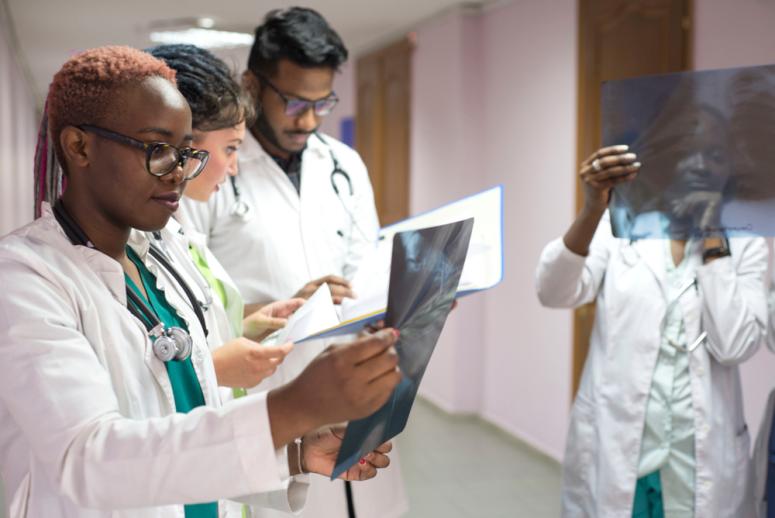 medical students working together and looking at xrays