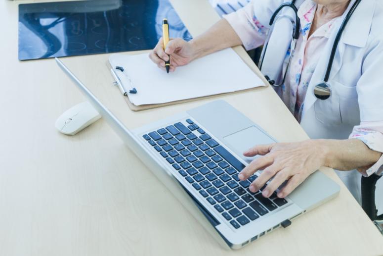 person typing on computer