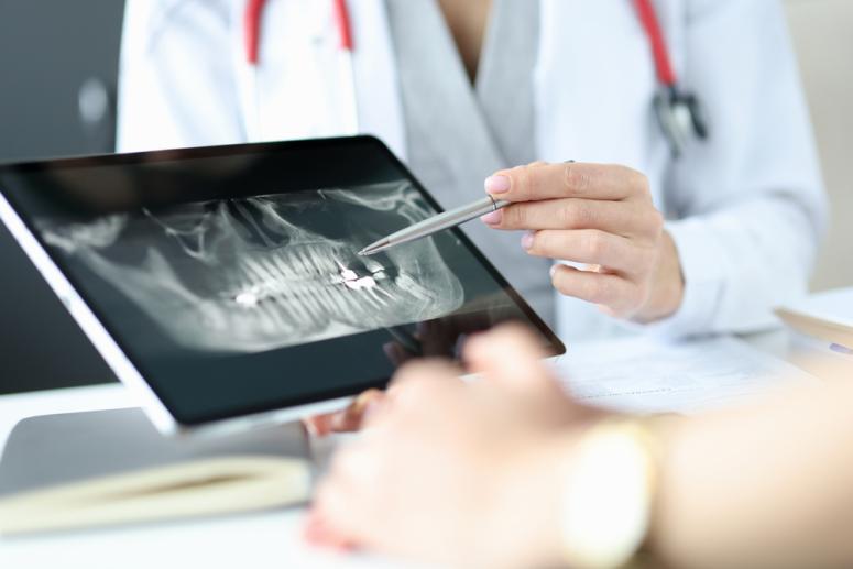 patient being shown dental x-ray