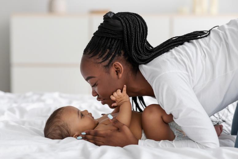 black mom with her baby cuddling
