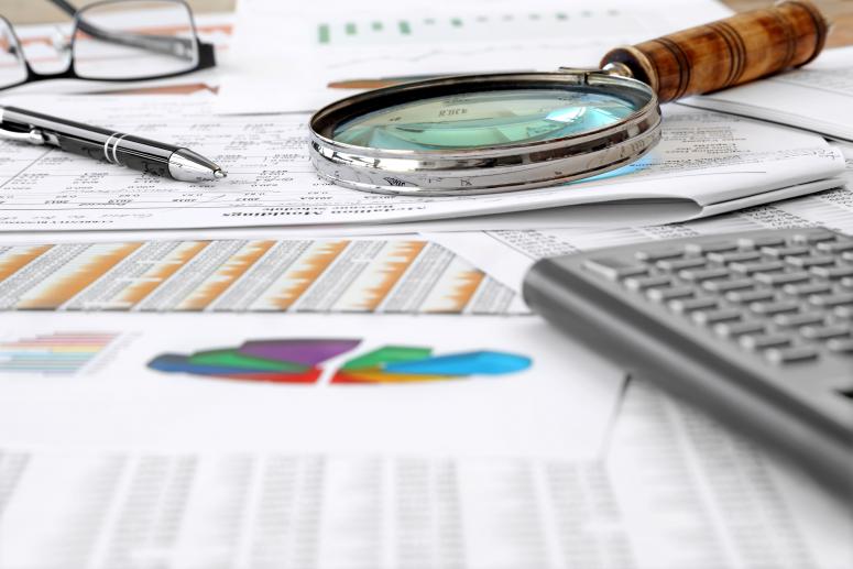 Accounting Tools, financial data and charts on the Table