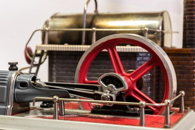 View of the flywheel of a steam engine stock photo