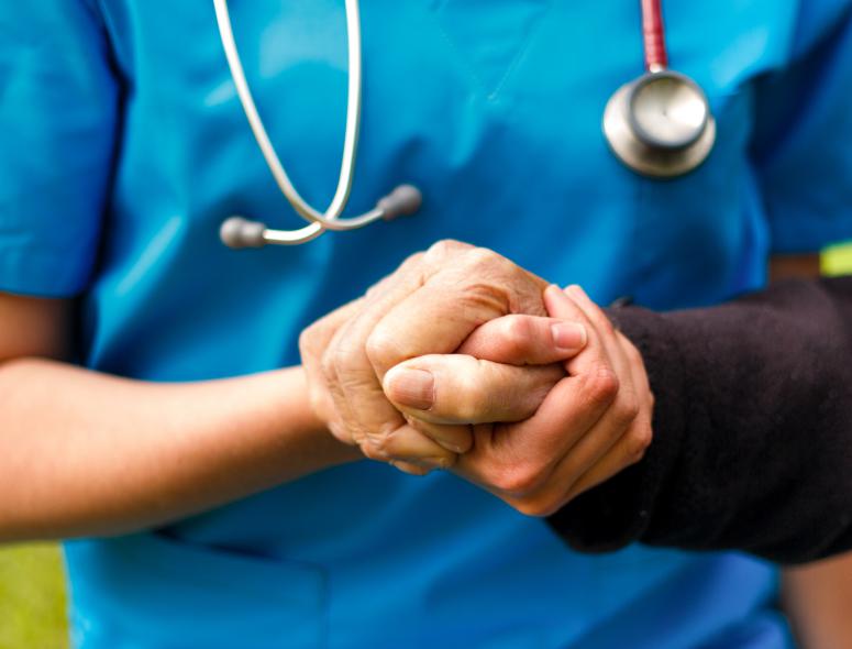 nurse hand holding atient hand