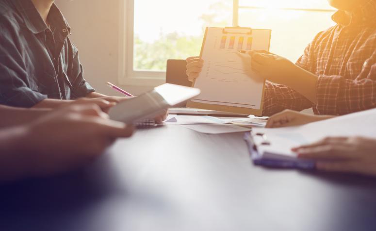 Businessman making presentation with his colleagues and business strategy at the office with graphs and charts being demonstrated,Pie Graph Analysis Statistics Report Concept,vintage color