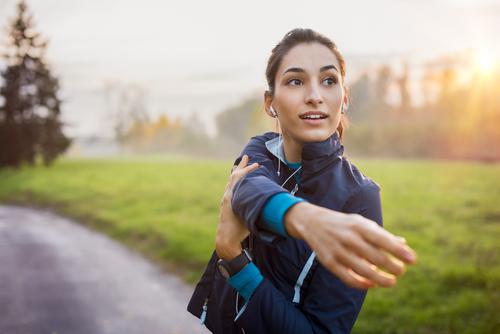 woman stretching outside