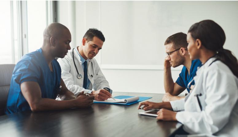 doctors collaborating at a table 